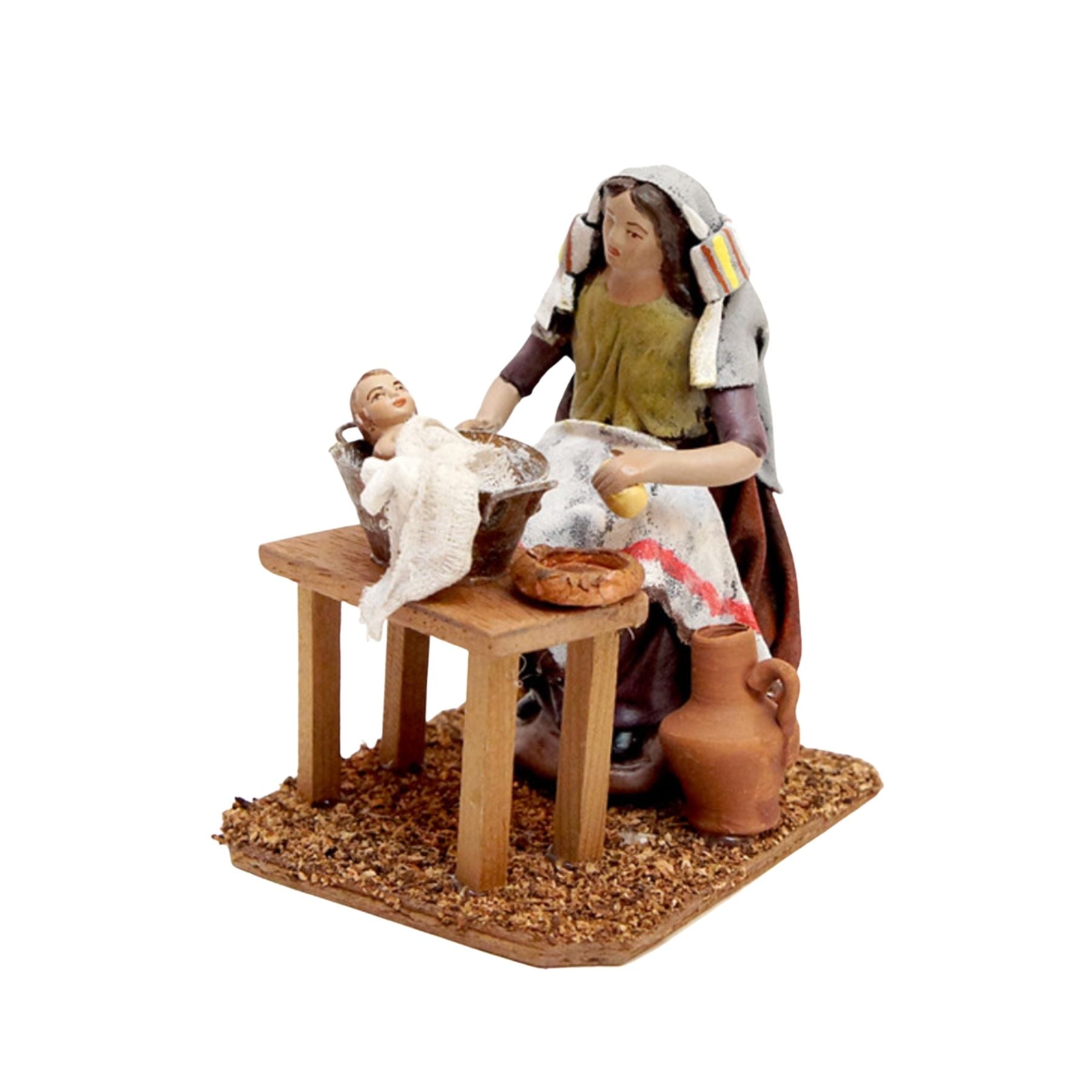 Belenes Artesanos - Mujer bañando bebe